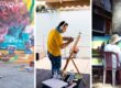 Three artists painting in different settings: a woman in yellow overalls by a colorful mural, a man at an easel on a dock, and a hat-wearing artist painting outdoors.