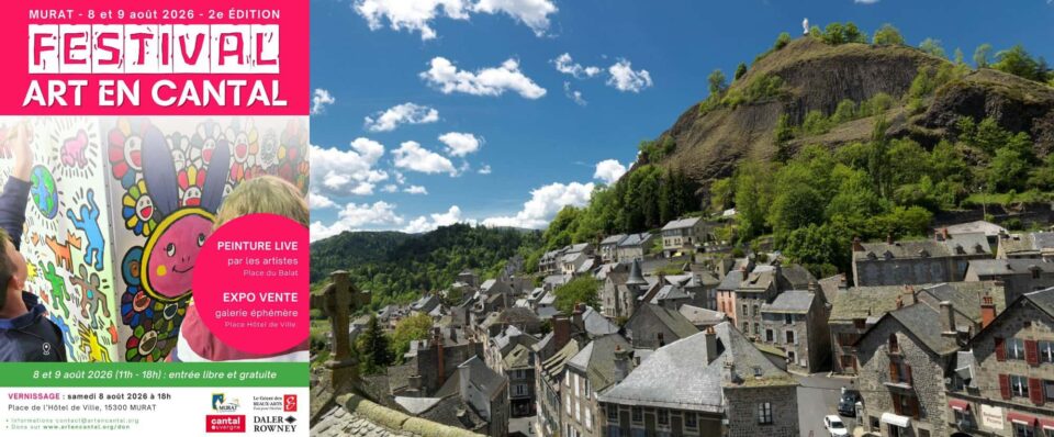 Bright pink festival poster on a mural announcing Festival Art en Cantal (Aug 8–9, 2026) with colorful drawings, over a town and hillside.